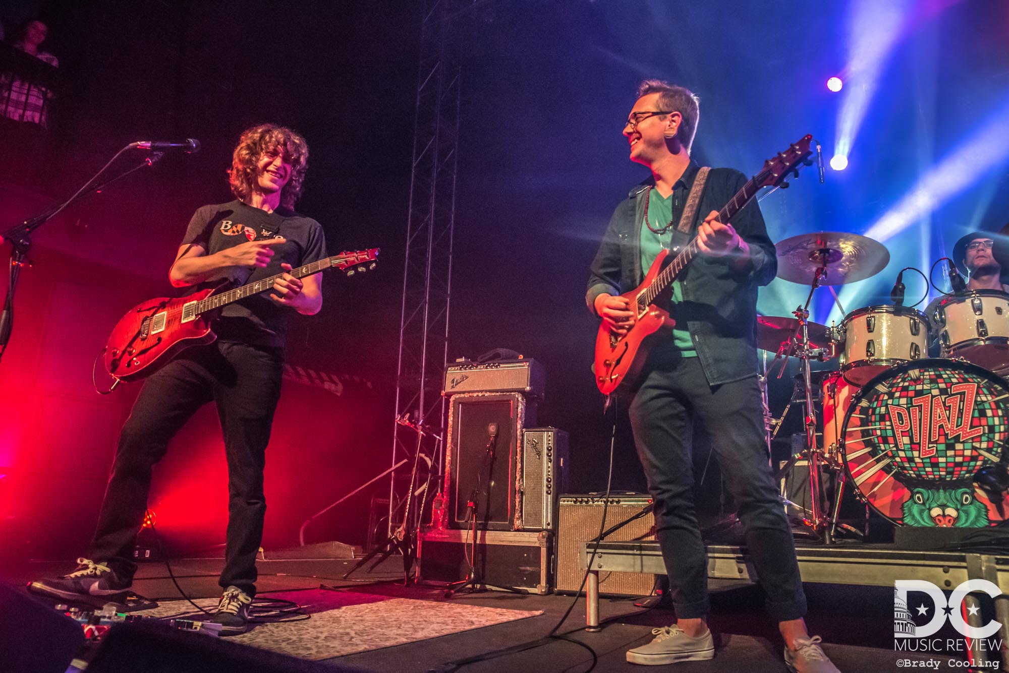 Jeremy Schon sharing a laugh with Jordan August on stage
