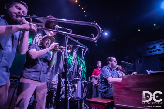 A truly powerful brass section flanks Kelly Finnigan.