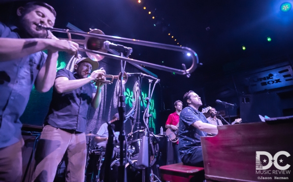 A truly powerful brass section flanks Kelly Finnigan.