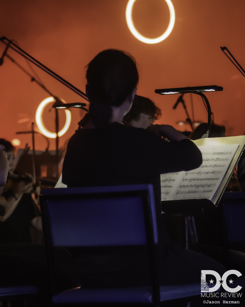 Members of The National Symphony Orchestra performing with Dispatch
